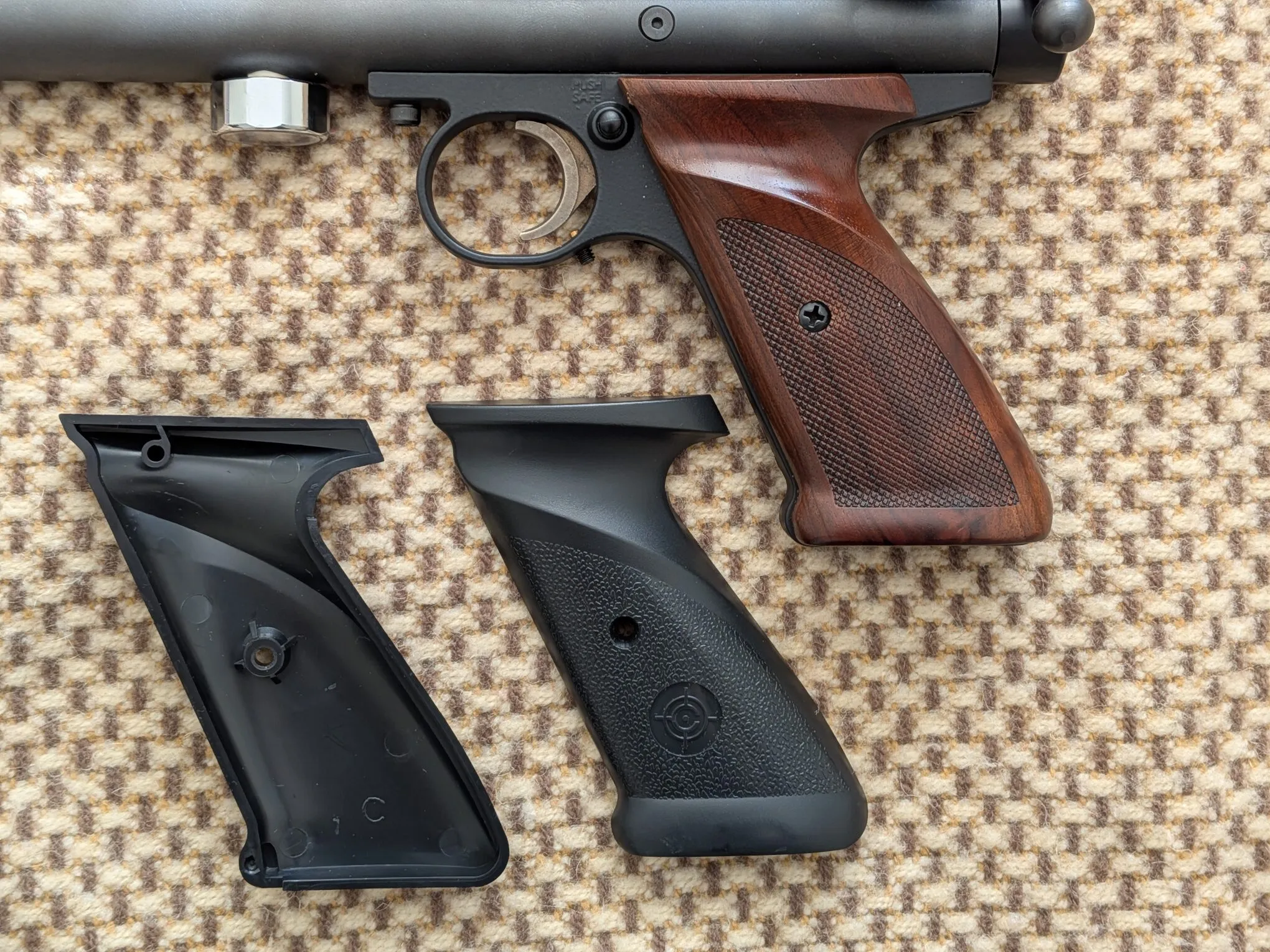 My added wooden grips fitted to the 1701P beside the original factory black plastic grip panels