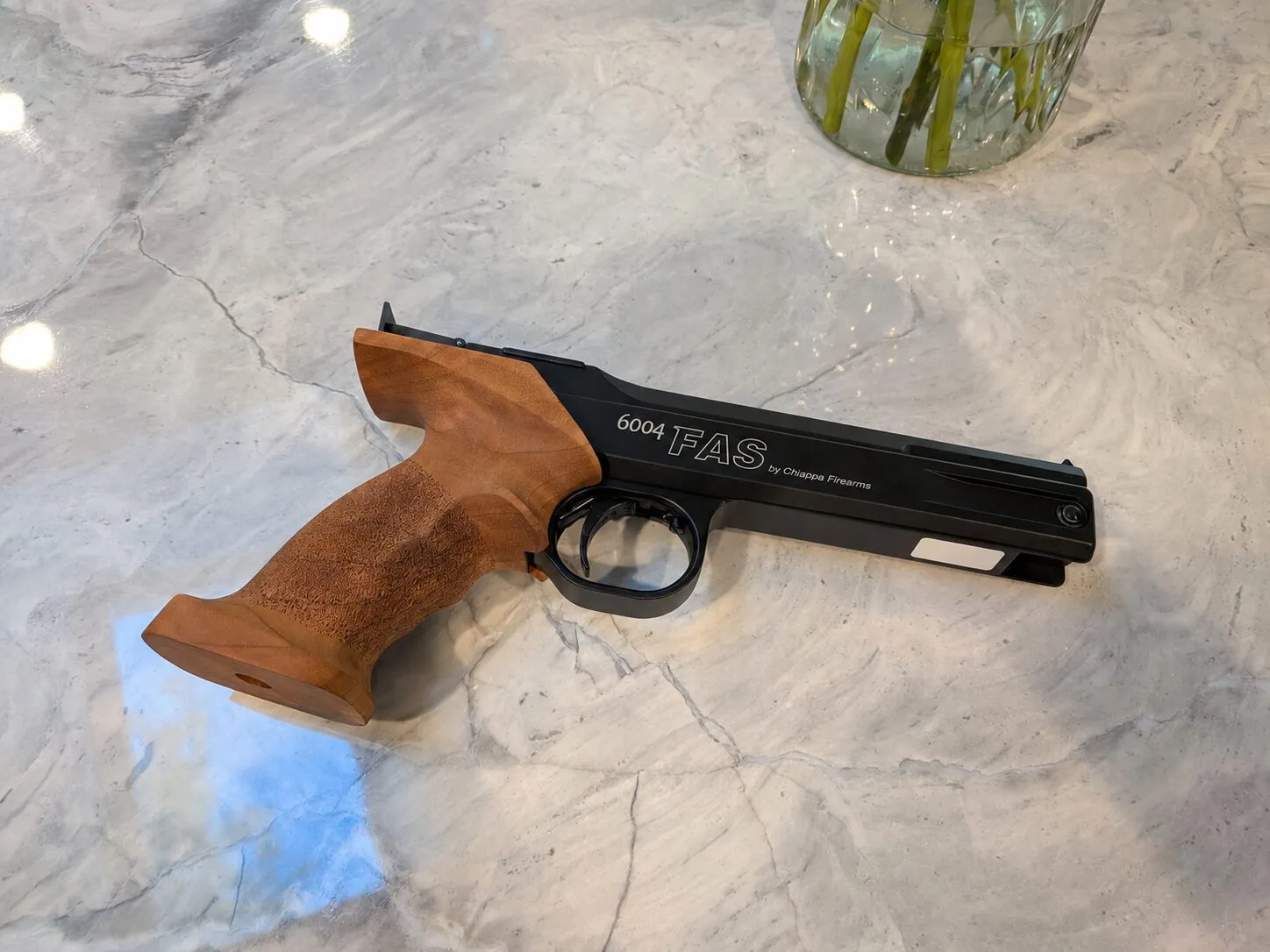 FAS 6004 with the ambidextrous grip, shown on the left