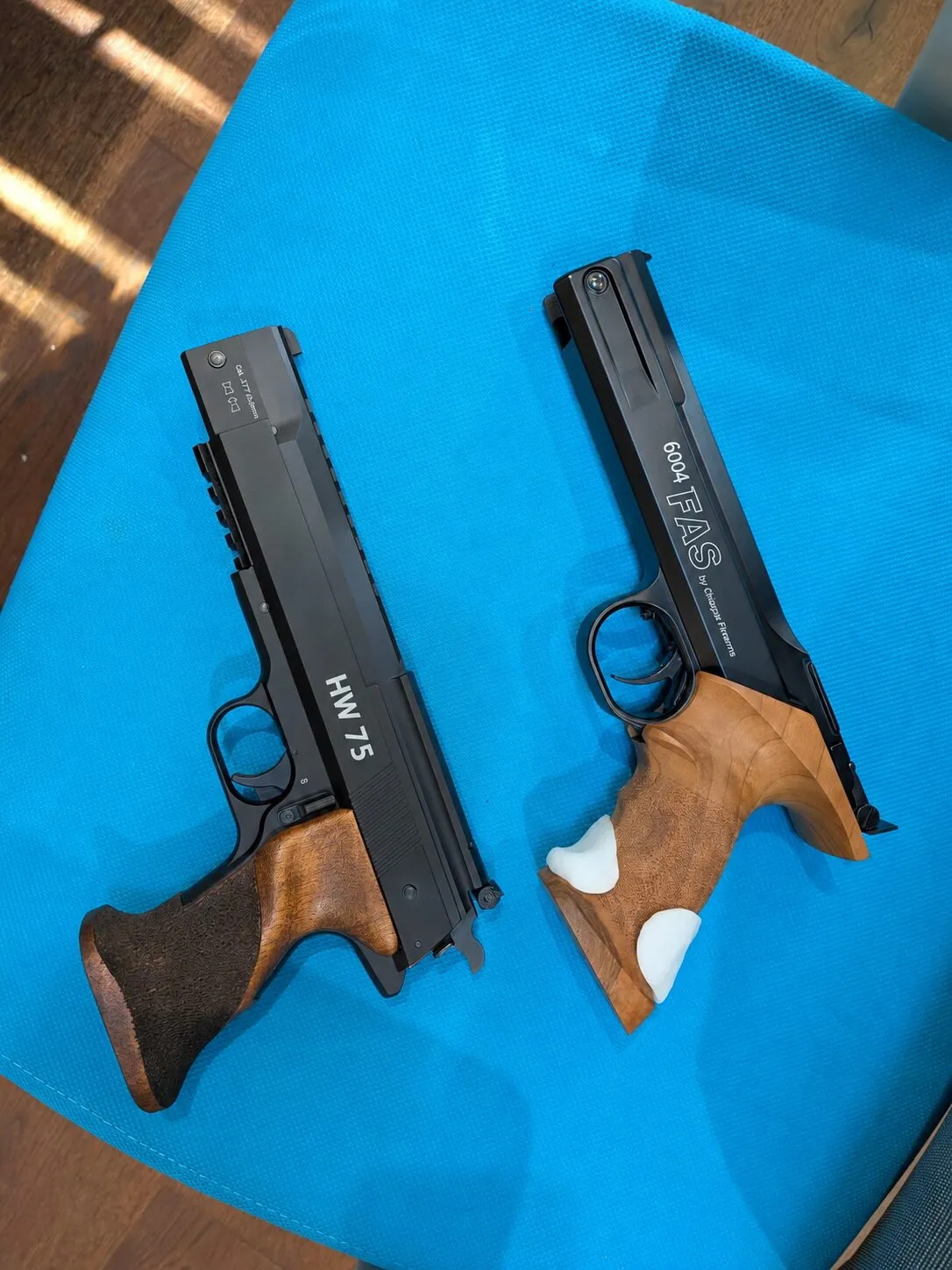 Weihrauch HW75 on the left and FAS 6004 on the right, showing their different grip shapes
