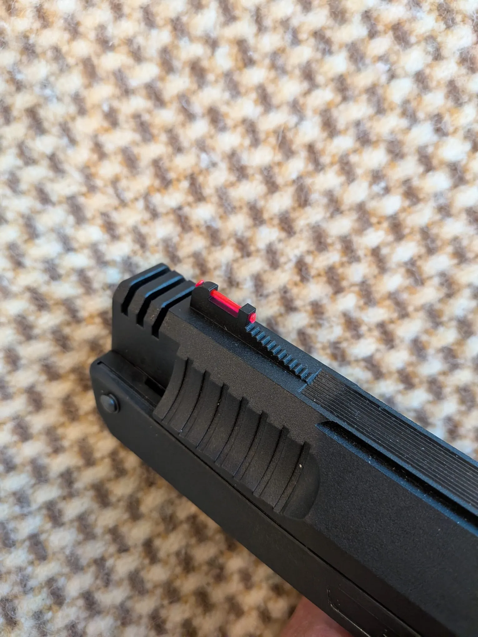 Similar HW40 front sight with its red fiber-optic rod intact, for comparison