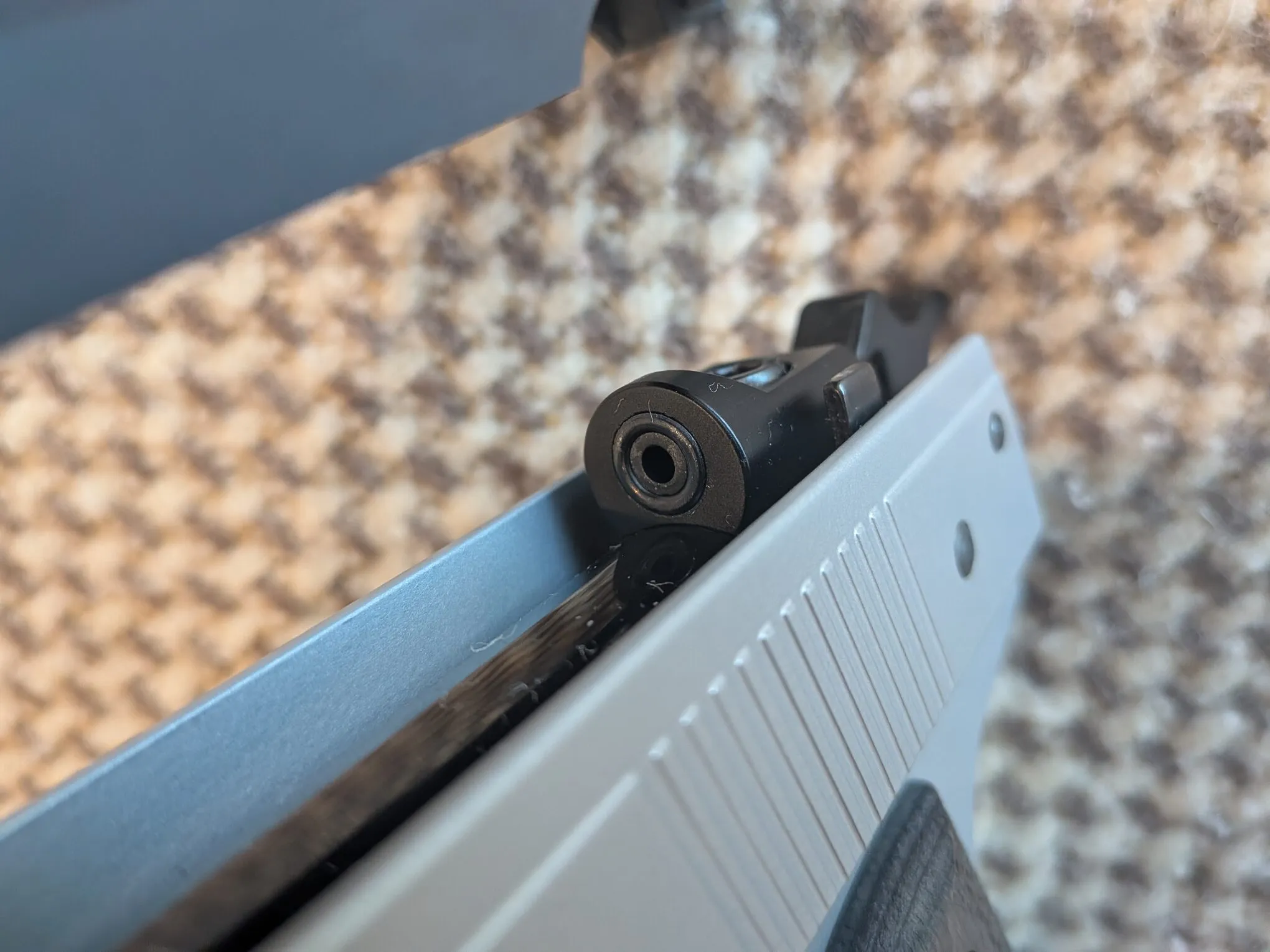 Close-up of the HW45 air outlet and surrounding breech seal in the lower assembly