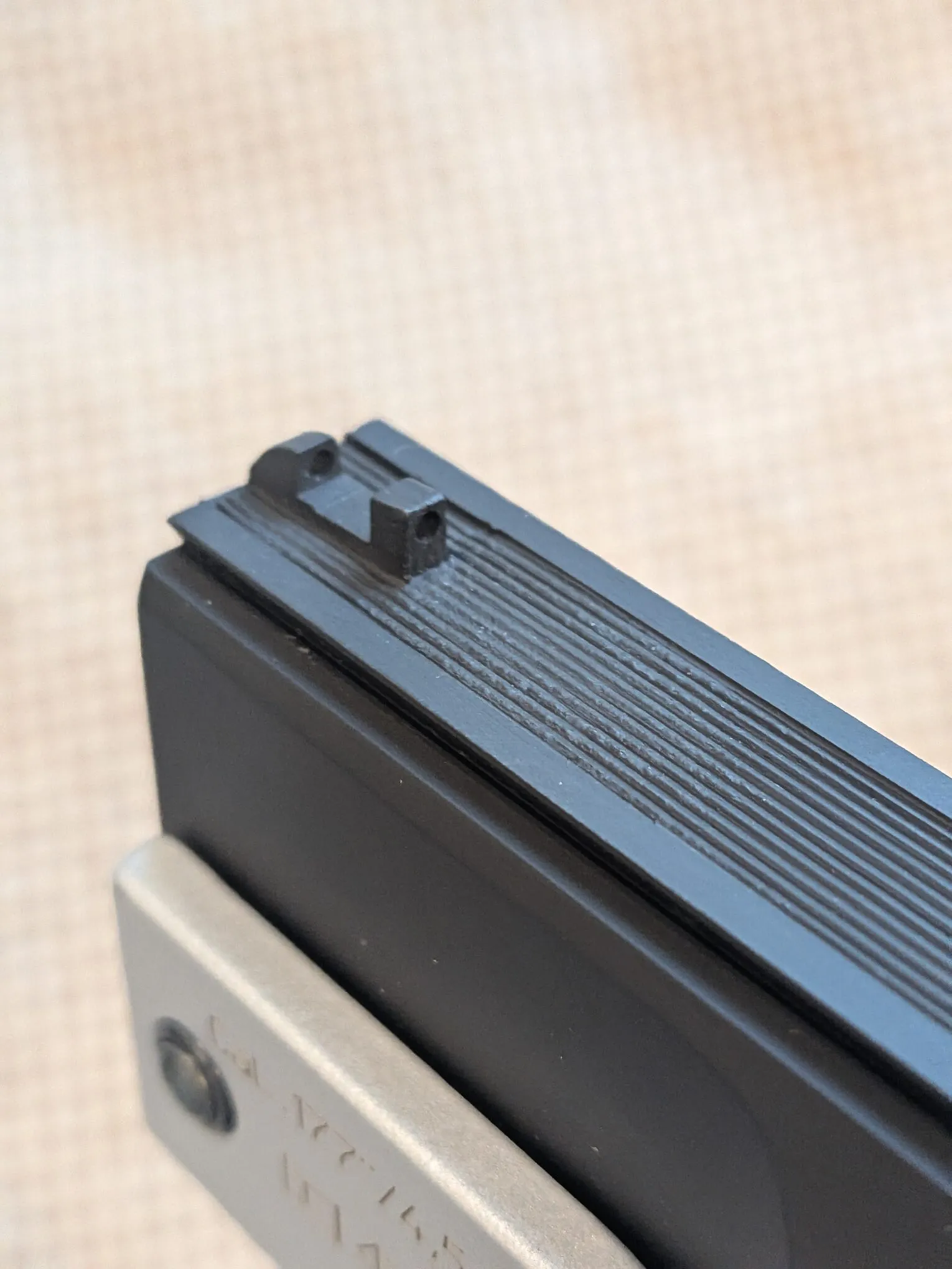 HW45 front sight with its plastic fiber-optic rod snapped and missing from the sight body