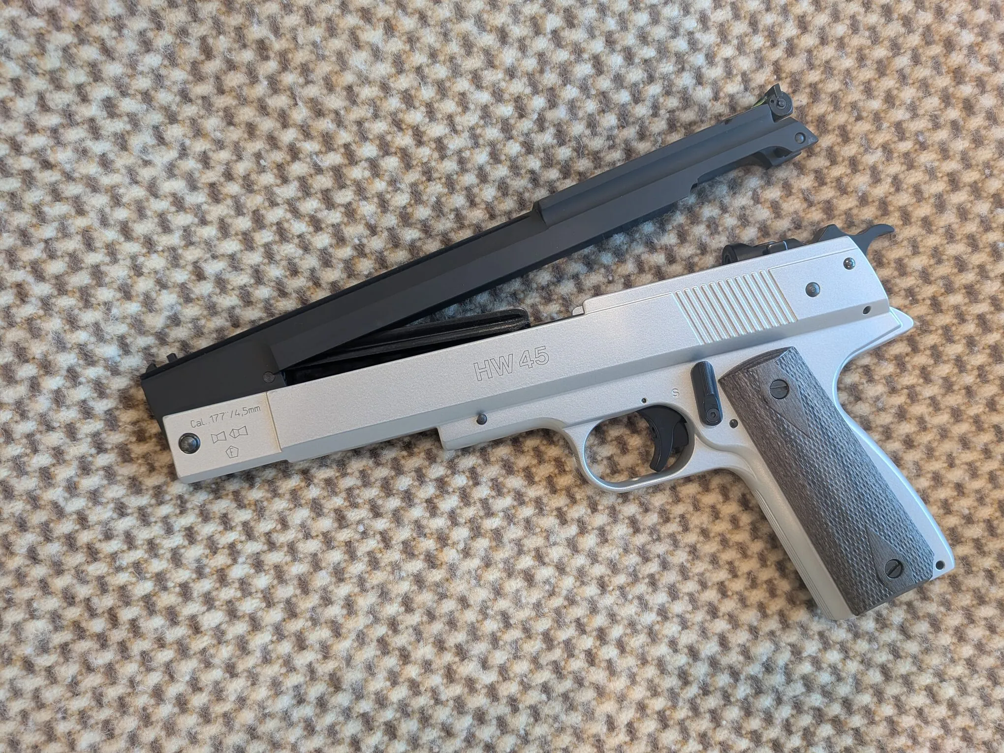 HW45 with its upper assembly slightly open after releasing the rear latch