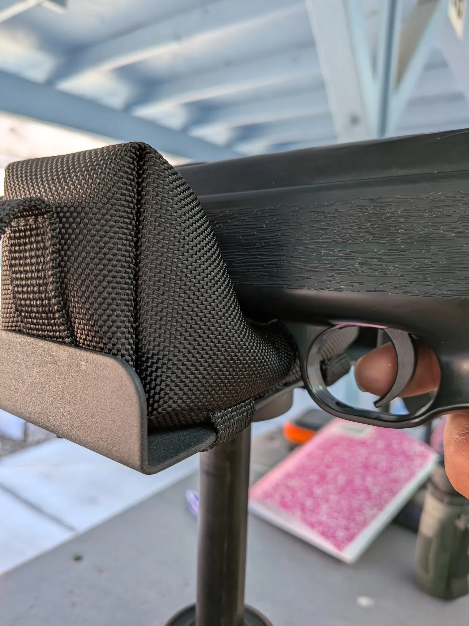 HW70A supported beneath the synthetic stock ahead of the trigger guard, the position that worked best for me