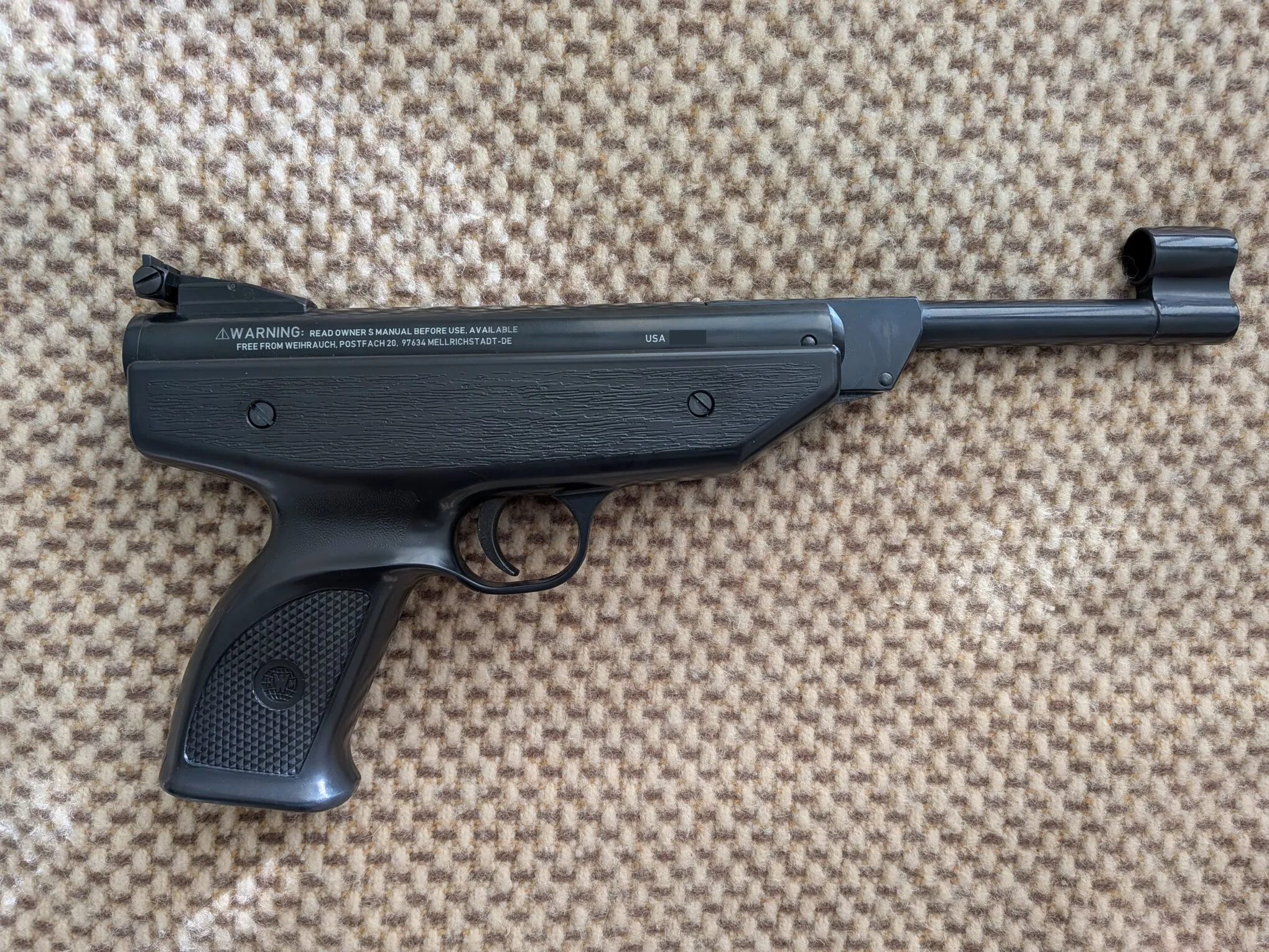 Right-side profile of the HW70A showing its black synthetic stock, grip, and exposed barrel