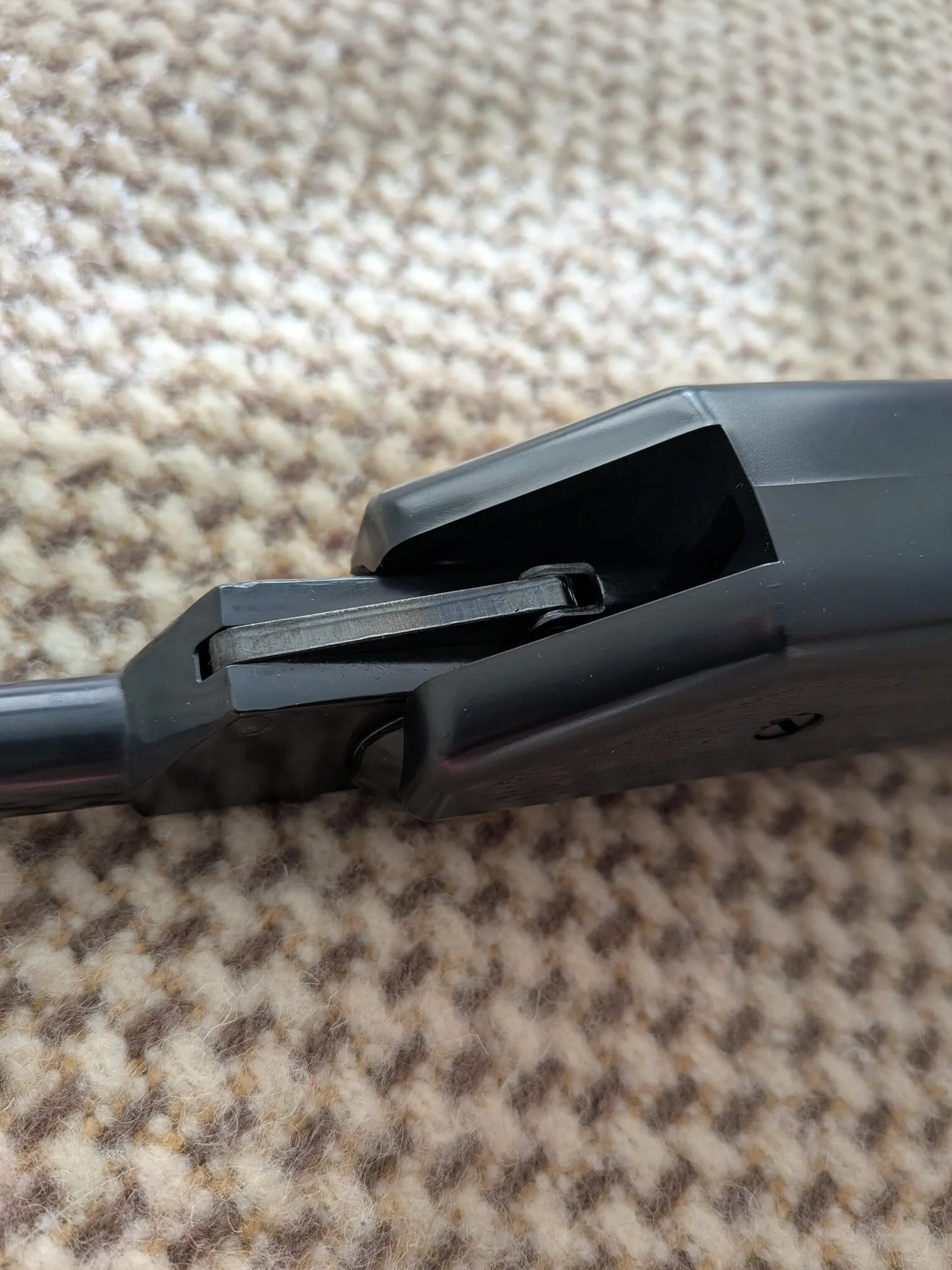Cocking linkage beneath the HW70A barrel and cylinder