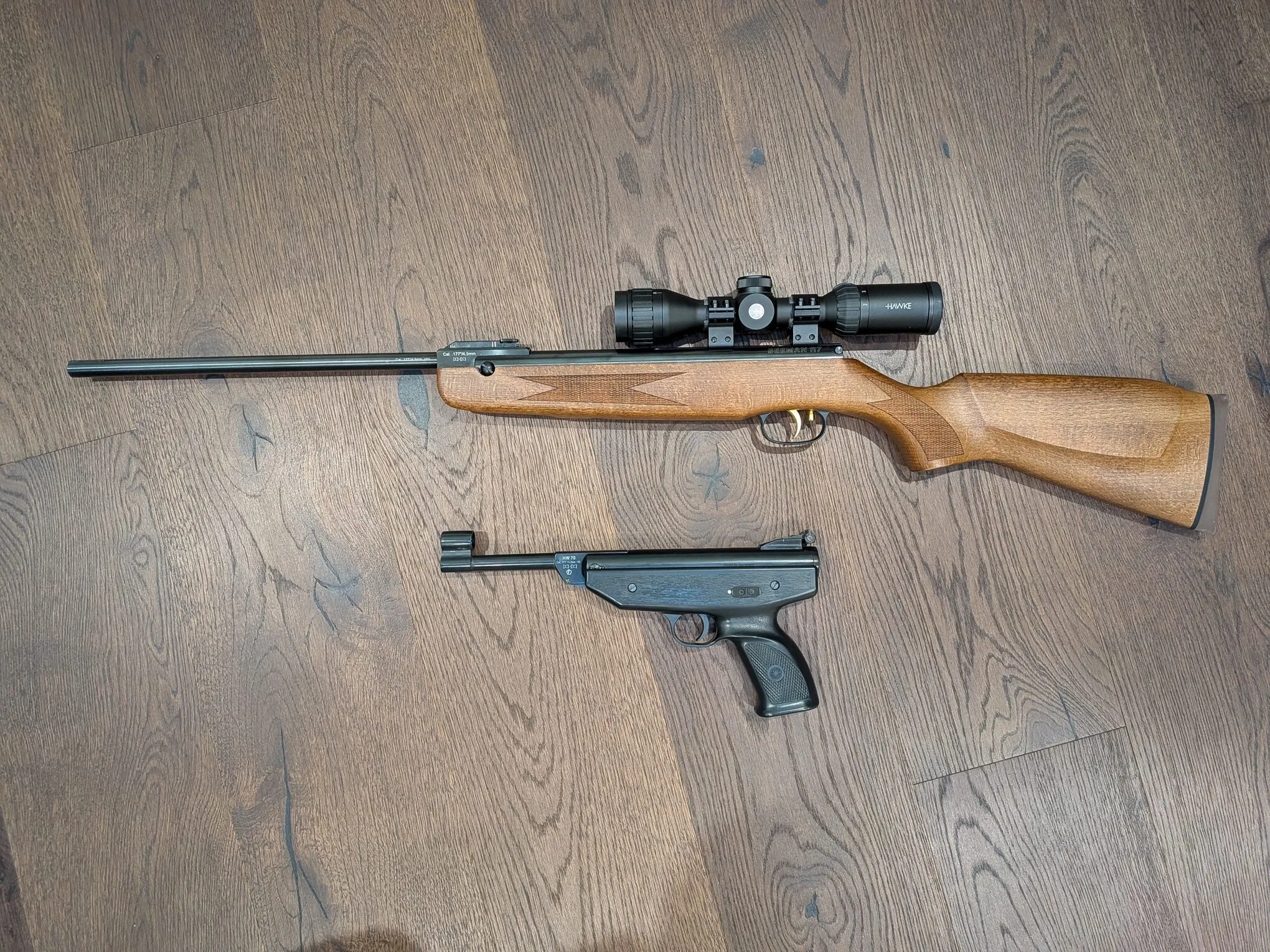 Beeman R7 rifle above the HW70A pistol, showing their similar break-barrel layouts