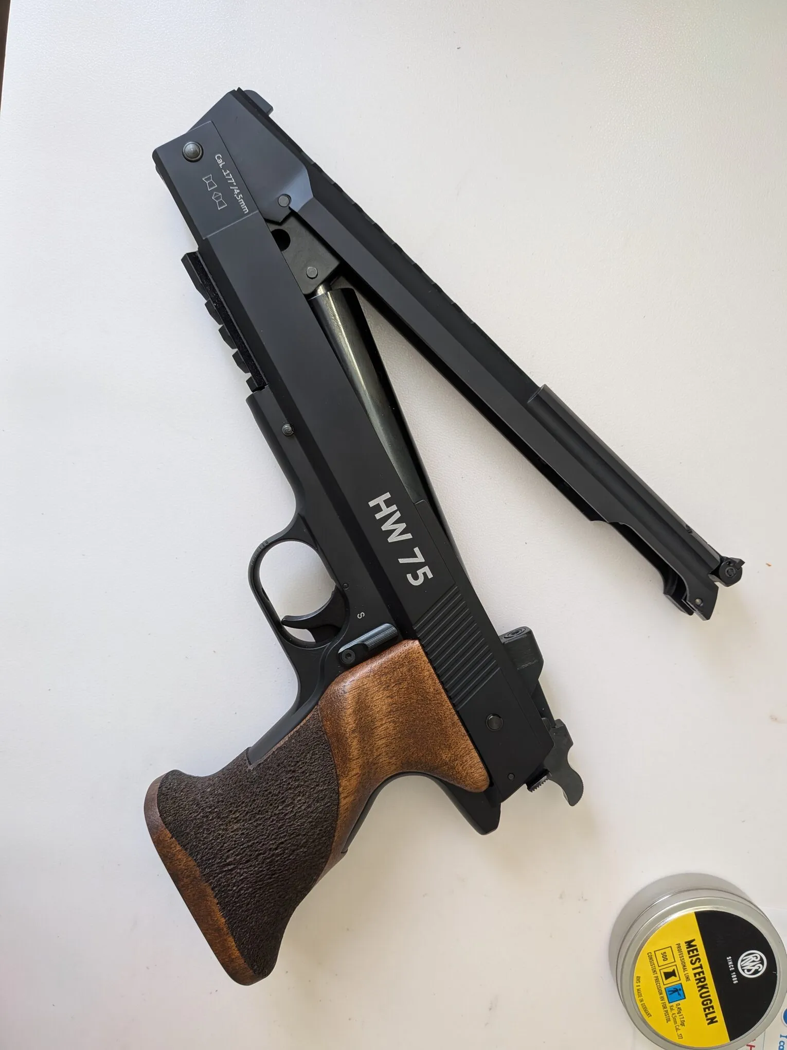 HW75 with its upper assembly partly open, exposing the compression mechanism