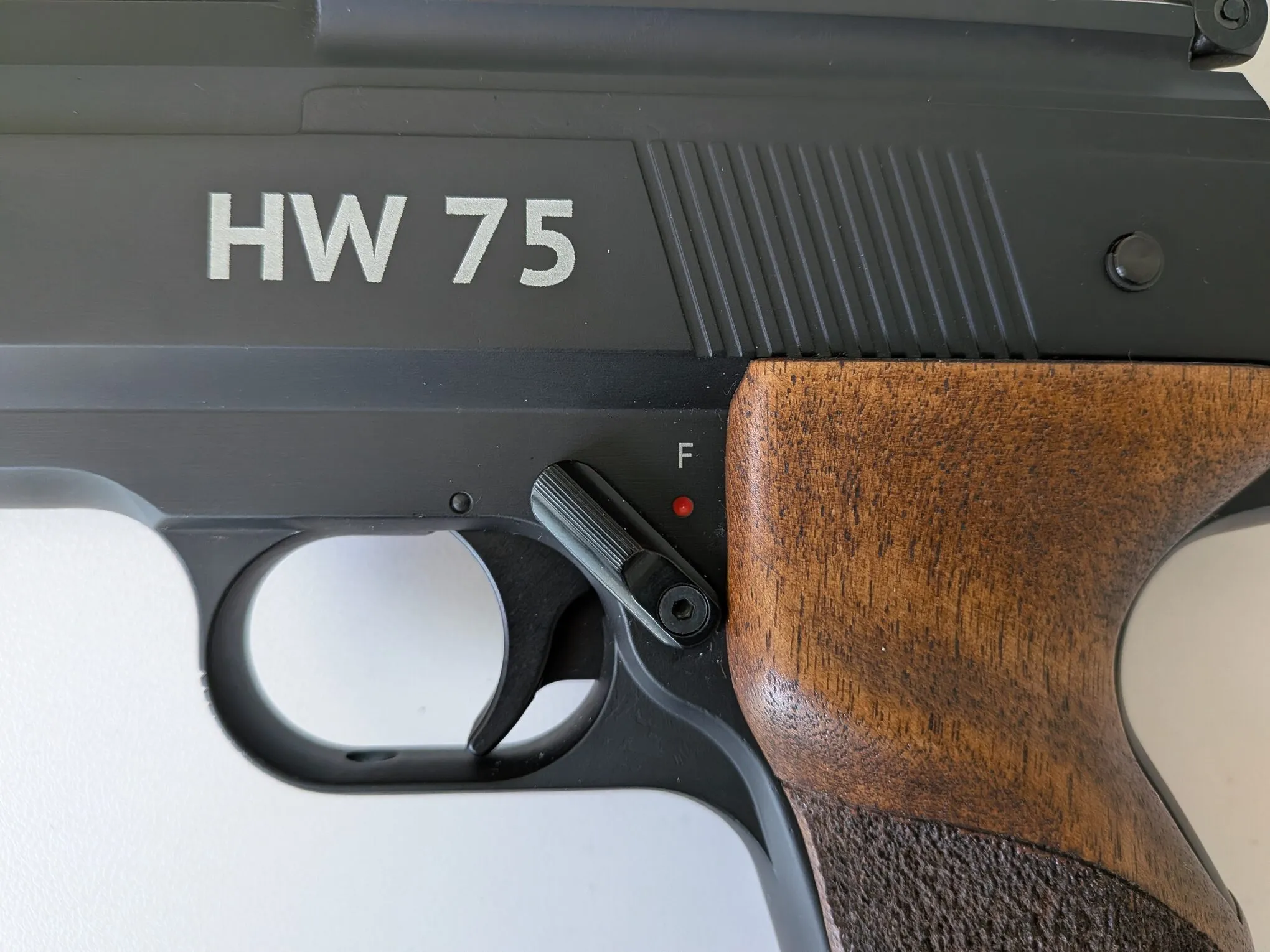 HW75 safety disengaged, showing the F marking and red dot